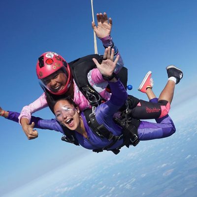 Tandem skydivers over Skydive Spaceland